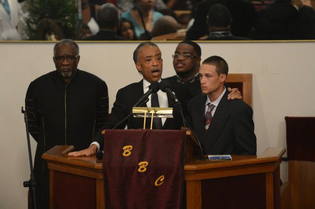 The Rev. Al Sharpton with Ramsey Orta at Eric Garner's funeral